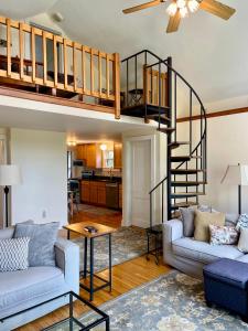 a living room with a loft bed and a couch at The Lookout - Spacious Apartment in Superb Location in Burlington