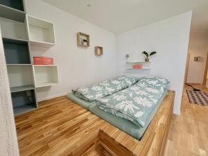 Voodi või voodid majutusasutuse Familienfreundliche Ferienwohnung mit Garten in Moos Weiler am Bodensee toas