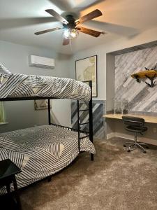 a bedroom with a bunk bed and a desk at Modern 2BR Retreat in Harbor in Harbor Springs