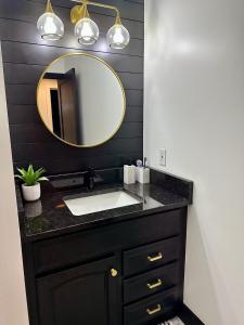 a bathroom with a sink and a mirror at Modern 2BR Retreat in Harbor in Harbor Springs