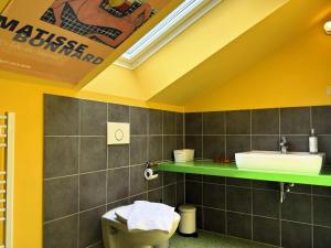 a bathroom with a sink and a toilet at Gruppenhaus in Buntenbock in Buntenbock