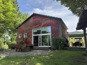 a barn with a mural on the side of it at Gruppenhaus in Buntenbock in Buntenbock
