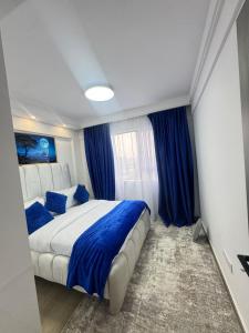 Postel nebo postele na pokoji v ubytování Orchid residency