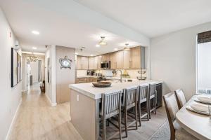 an open kitchen and dining room with a table and chairs at Tranquillity on 30A Unit# 210 by 30A Escapes in Seacrest +21 photos