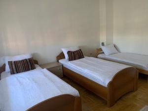 a room with two beds in a room at Villa Zehra Ilidza in Sarajevo