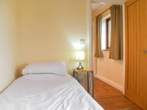Ένα ή περισσότερα κρεβάτια σε δωμάτιο στο Swift Cottage +9 φωτογραφίες