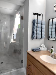 a bathroom with a shower and a sink at Water Street Retreat in Chelan