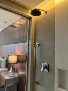 a bathroom with a shower with a sink and a bed at Hotel Nacional in Rio de Janeiro +9 photos