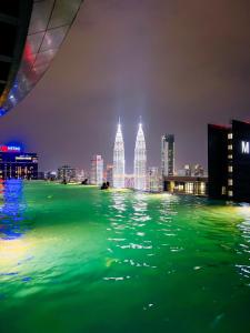 a view of a city skyline at night at Eaton Residences KLCC - Luxury Apartment in Kuala Lumpur