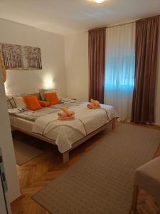 Una cama o camas en una habitación de Kuća JEKA