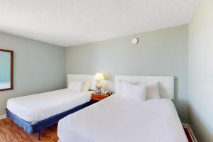 Voodi või voodid majutusasutuse Ocean Park Resort 1222 toas +33 fotot