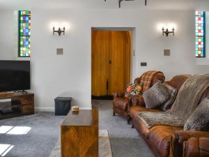 a living room with a couch and a coffee table at St Mildred's Church in Ramsgate