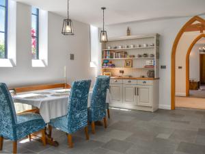 a dining room with a table and chairs at St Mildred's Church in Ramsgate