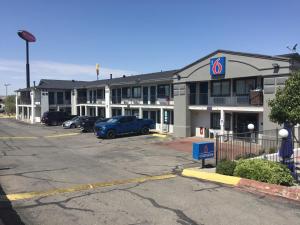 a hotel with cars parked in a parking lot at Motel 6-El Paso, TX - West in El Paso