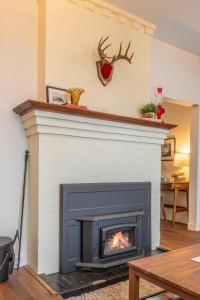 a fireplace in a living room with a fire place at Chalet Haesler Jr - Edelweiss Village in Golden