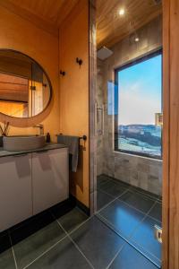a bathroom with a sink and a large window at Beresford Heights & Rise in Maclennan +78 photos