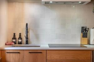 a kitchen with a sink and a counter top at Chalet Haesler Sr - Edelweiss Village in Golden