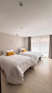 Postel nebo postele na pokoji v ubytování HOTEL COMFORT INN Torre B