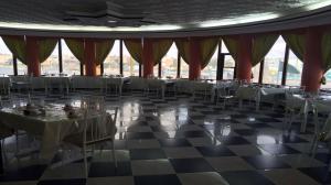 a banquet hall with tables and chairs in a building at شركة حامد مدوح الحازمي للتجارة in Ţurayf