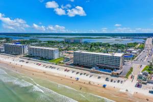an aerial view of the beach and buildings at Atlantic Skies in Daytona Beach Shores