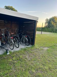 a group of bikes parked next to a building at Samosiejka SPA Słońsko in Słońsko