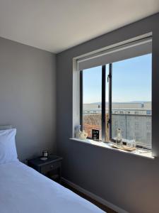 a bedroom with a bed and a window with a view at Dublin Private Room in Dublin