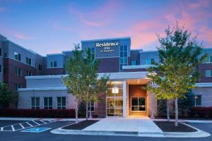 a hospital building with trees in front of it at Residence Inn by Marriott Omaha Aksarben Village in Omaha