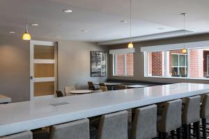 a conference room with a large table and chairs at Residence Inn by Marriott Omaha Aksarben Village in Omaha +32 photos