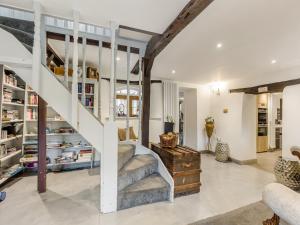a living room with a staircase and a stair case at Ladymoor in Highley +35 photos