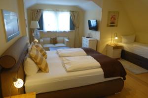 Säng eller sängar i ett rum på Hotel Villa Konstanz
