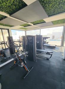 a gym with cardio bikes and elliptical machines at Live Playa Beach, Luxury & 5th Av at your doorstep in Playa del Carmen
