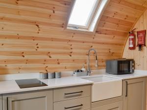 a kitchen with a sink and a window at Beech - Uk47622 in Hunmanby