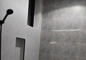 a bathroom with a shower with a mirror at شقه فرح Farah Apartment in Hail +13 photos