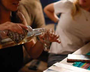 a woman is drinking from a wine glass at El Pinche Hostal in Guadalajara +40 photos