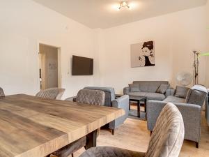 a living room with a table and chairs at Breite Str 154 Selm in Selm