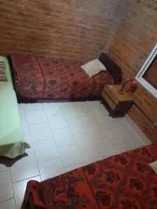 an overhead view of a bedroom with a bed at Cabaña Paralelo 1 in Viedma