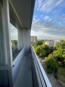 an apartment balcony with a view of a city at Panorama building in Eschborn