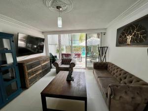 a living room with a couch and a table at 1 VENATOR House Boutique in León
