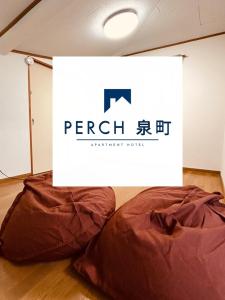 Katil atau katil-katil dalam bilik di Perch泉町