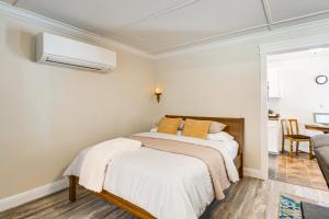 a bedroom with two beds and a dining room at Gateway to Crater Lake Cabin in Klamath Falls! in Rocky Point