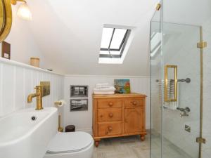 a bathroom with a sink toilet and a shower at Island House in Fowey +30 photos
