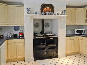 Kuchyň nebo kuchyňský kout v ubytování The Coach House + 6 fotografií