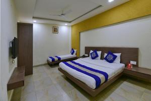 En eller flere senge i et værelse på Hotel O SVL + 17 billeder