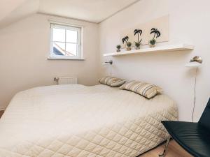 Ένα ή περισσότερα κρεβάτια σε δωμάτιο στο 4 star holiday home in Bogense