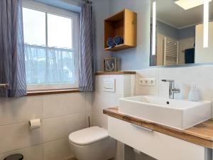 Koupelna v ubytování Haus Windflüchter + 28 fotografií