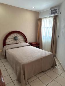 Giường trong phòng chung tại Departamento Tortuga +18 ảnh