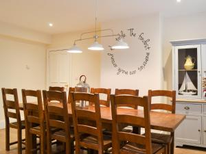 a dining room with a table and chairs at Princess Lodge in Scarborough