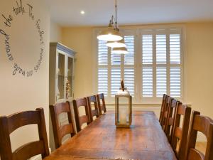 a dining room with a long table and chairs at Princess Lodge in Scarborough +20 photos