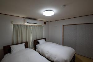 En eller flere senge i et værelse på White Dream Lodge Furano + 63 billeder