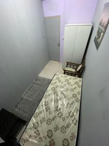 a small room with a shower with a curtain at Sharing apartment in Abu Dhabi